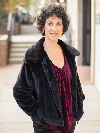 wear this black faux fur zip up jacket for a glamorous touch to any holiday outfit during the christmas season