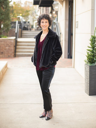 wear this black faux fur zip up jacket for a glamorous touch to any holiday outfit with statement boots