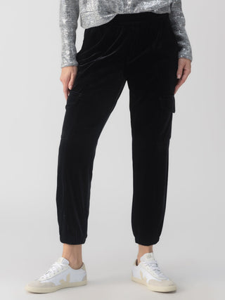 a fun pair of black velvet joggers with a relaxed fit and cargo pockets