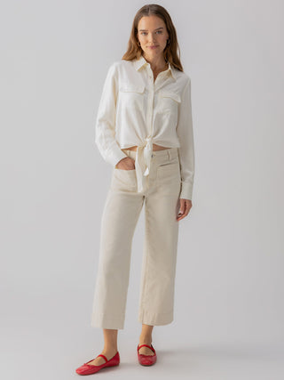a comfy pair of cropped wide leg denim french vanilla colored pants with patch pockets worn with white blouse