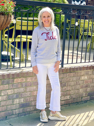 soft and comfortable gray crimson tide vintage sweatshirt worn with white pants