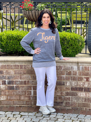 comfortable vintage gray sweatshirt with orange auburn tigers print worn with white pants