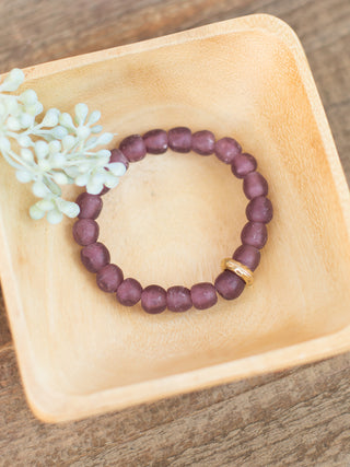 a purple sea glass beaded bracelet with gold details great for everyday jewelry wear and small gifts