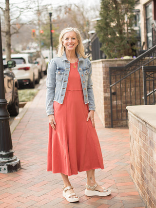 comfortable rose clay colored short sleeve midi dress with empire waist worn with jean jacket