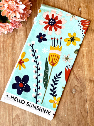 vibrant positive tea towel with a floral pattern and hello sunshine vibe
