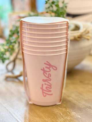 plastic party cups in pink that say thirsty