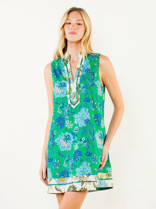 a vibrant tropical sleeveless mini dress with a green and blue floral pattern