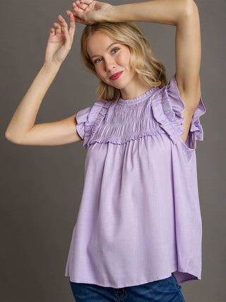 bright lavender blouse with ruffled sleeves and smocked yoke
