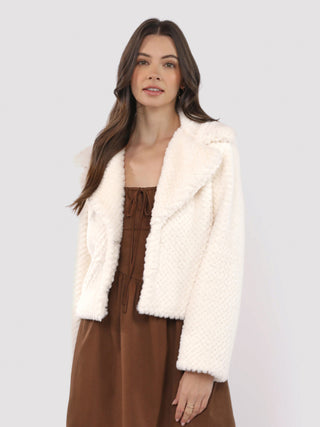 a soft ivory faux fur collared jacket