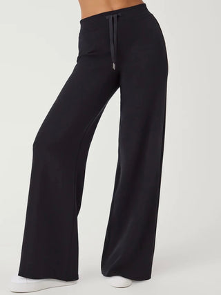 a pair of trendy extra wide leg black pants with a high waistline perfect for stylish everyday dressing 