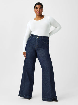 a basic white spanx long sleeve crew neck body skimming top