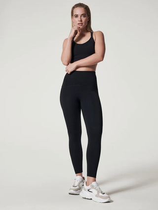 black high waist leggings from spanx with built in butt lift shown with black crop tank