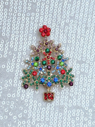 a vibrant sparkling holiday christmas tree clothing pin