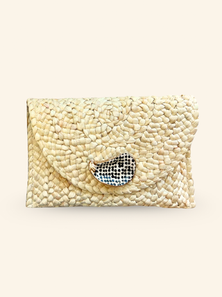 a natural beachy straw clutch handbag with an oyster detail