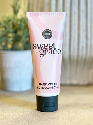 the perfect travel size hand cream in a pink bottle filled with floral scent
