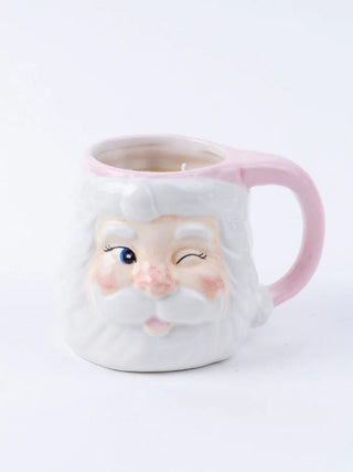 a pink santa coffee mug with a sweet grace candle inside