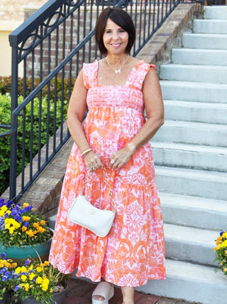 orange and pink floral midi dress with square neckline and ruffle straps
