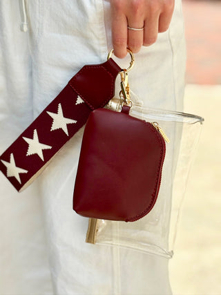 clear maroon and white mini wristlet bag with star strap zipper closure and removable maroon pouch inside