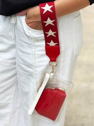 clear red and white mini wristlet bag with star strap zipper closure and removable red pouch inside