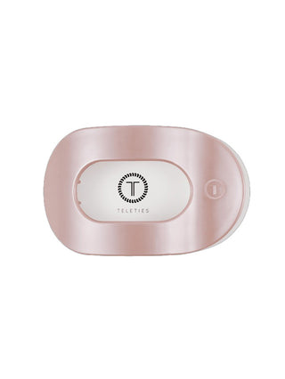 a light spring pink flat round teleties hair clip