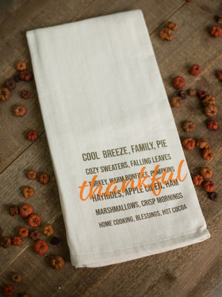 a cream handprinted towel with gratitude phrases printed across perfect for thanksgiving fall decor gifts