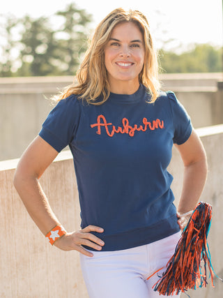 a navy sweater tshirt with orange glitter text that reads auburn perfect for war eagle football fans  