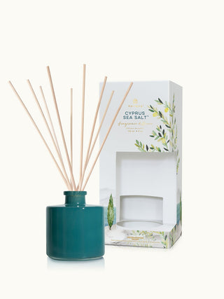 a blue green oil diffuser with thymes summer sea salt scented oil