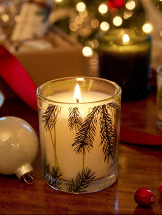 a classy holiday scented candle with a pretty pine needle design