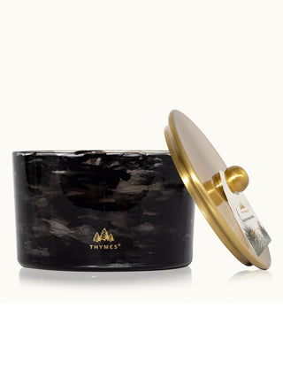 noir woods black smoky candle with wood crisp evergreen and glowing amber vibes