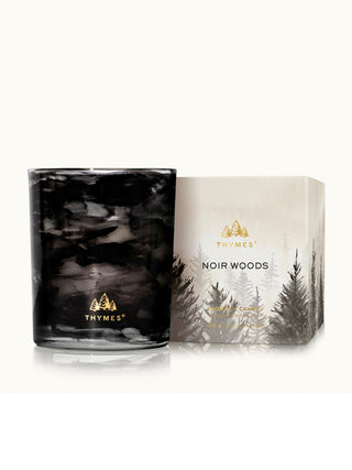 noir woods black smoky candle with wood crisp evergreen and glowing amber vibes