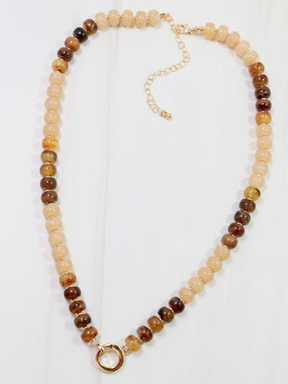 brown and cream beaded necklace with gold toggle