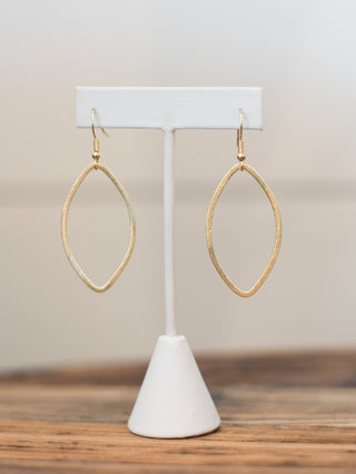 a pair of gold teardrop dangle earrings in lightweight material perfect for daily jewelry wear