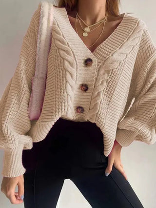 tan knit cardigan sweater with brown buttons and billowy sleeves