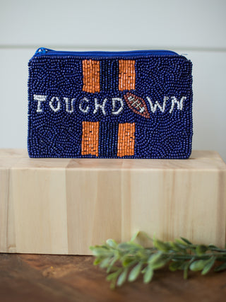 an auburn university game day coin with navy and orange beading and the sentiment touchdown for war eagle pride