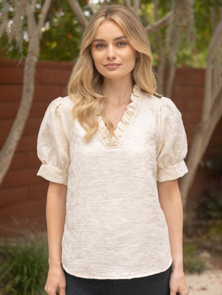 cream blouse with velvet floral print short puff sleeves and v neck with ruffled details