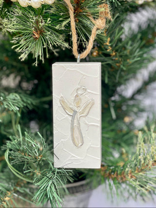 a painted white wooden plaque ornament with an angel image