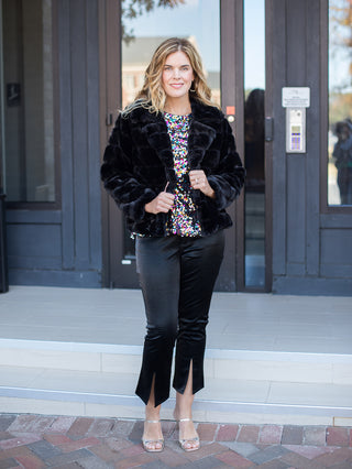 wear this black faux fur coat with luxurious detail for a glamorous outfit to festive holiday parties with a glitter top