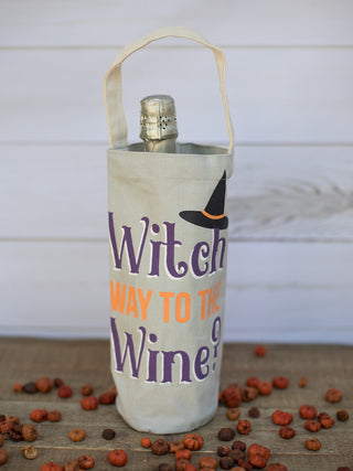 a canvas halloween themed wine bag that reads witch way to the wine perfect for spooky season gifts