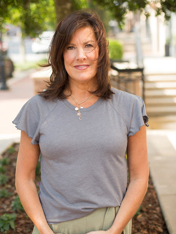 a gray top with flutter short sleeves with a crew neckline 