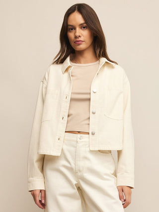 an off white cream cropped denim jacket with silver buttons