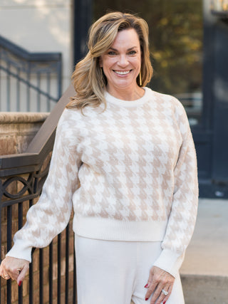 wear this classic white and beige sweater with houndstooth patterns to thanksgiving dinner and on cozy winter days