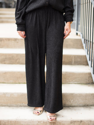wear these black lounge pants in a relaxed fit for a comfortable chic winter look