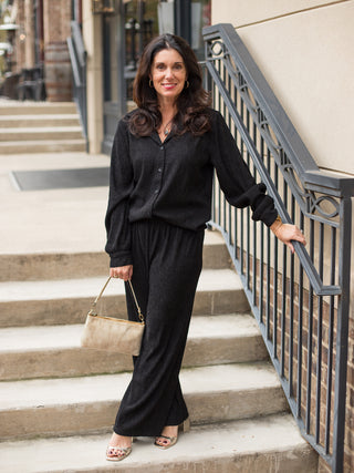 wear these black lounge pants in a relaxed fit for a comfortable chic winter look with matching button up blouse