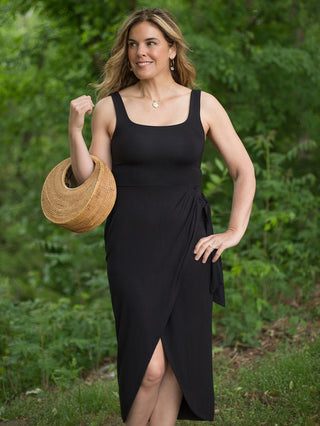 sleeveless sexy date night black dress with square neckline with crossover tie detail at the waist and split front hem
