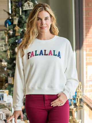 wear this off white lounge sweater with falalala across the chest on christmas morning and cozy winter days