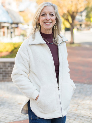wear this oversized off white active jacket with a front zipper for everyday errands and cozy winter days