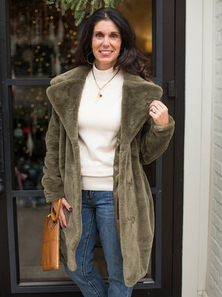 wear this olive green faux fur coat for a glamorous touch to holiday parties and family photoshoots