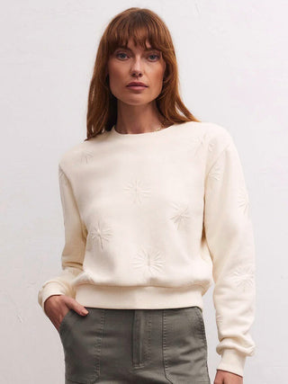 wear this off white sweatshirt with embroidered stars to casual christmas gatherings and cozy winter days