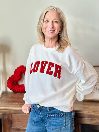 a cozy vanilla ice white sweatshirt that says lover in red