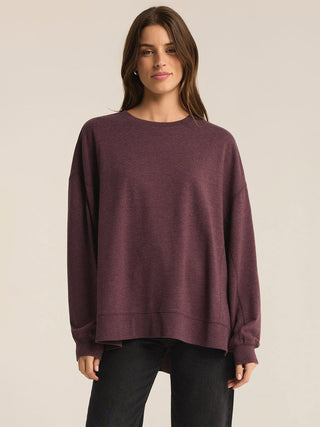 a cozy berry wine colored long sleeve pullover sweater